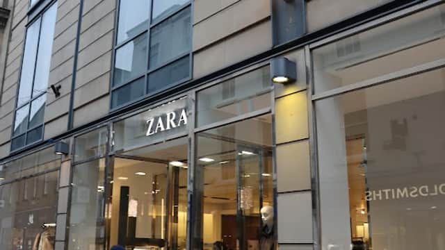 ZARA storefront in Brightside, Yorkshire, with shoppers entering and exiting, showcasing a modern glass facade.