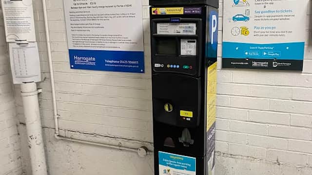 Pay & Display parking machine in West Park Multi Storey Car Park, with signage detailing charges and parking app info.