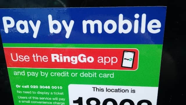 Pay by mobile sign for RingGo app, with location number 18008, at Unity House Car Park in Wakefield, Yorkshire.