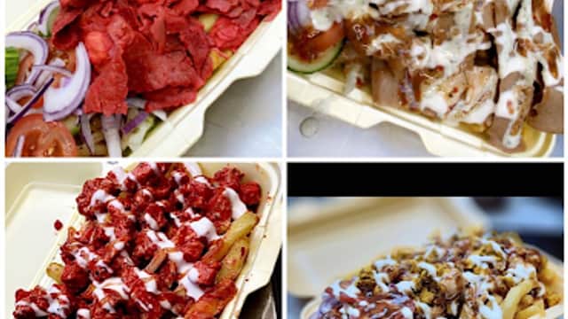 Four trays of loaded fries topped with various meats, onions, and sauces, from Pizza 55 in Birstall, Yorkshire.