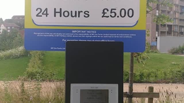 Pay & Display parking sign with pricing for 1, 6, 12, and 24 hours at Park Hill Flats, Sheffield.