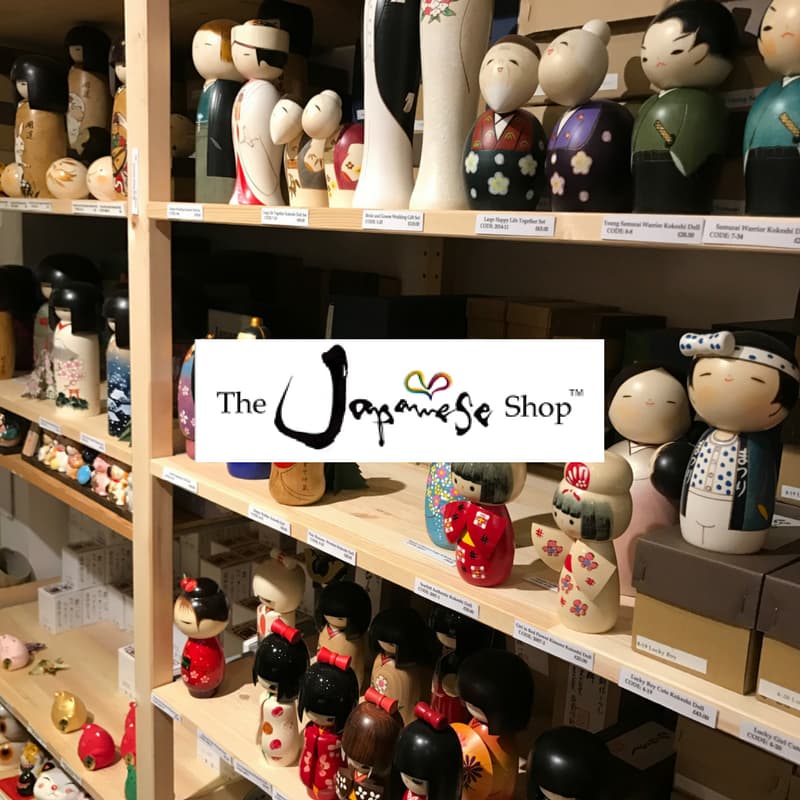 Shelves filled with colorful Japanese dolls and figurines at The Japanese Shop in Harrogate, Yorkshire.