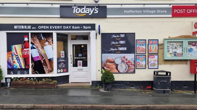 Londis store front with signage, open hours, and displays of drinks and snacks; post office and notice boards nearby.