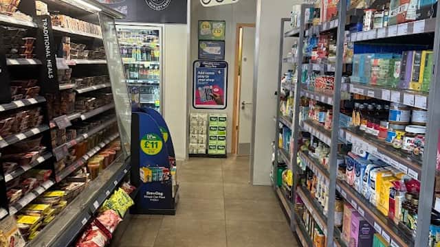 Interior of M&S Food To Go in South Milford, featuring shelves of snacks, drinks, and ready-to-eat meals.