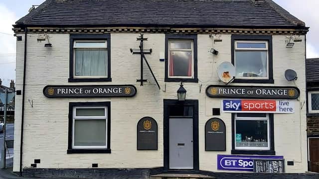 Bar exterior with "Prince of Orange" signage, satellite dishes, and sports broadcasting logos in Shelf, Yorkshire.