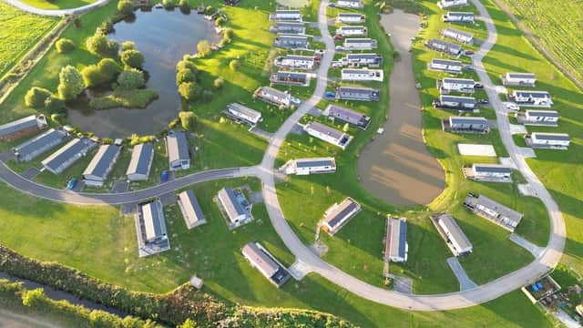 Aerial view of Lakeview Holiday Park featuring caravans, ponds, and green landscapes in Atwick, Yorkshire.