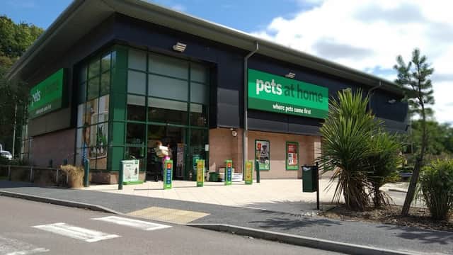 Pets at Home store exterior with green signage, large windows, and a landscaped entrance in Dronfield, Yorkshire.
