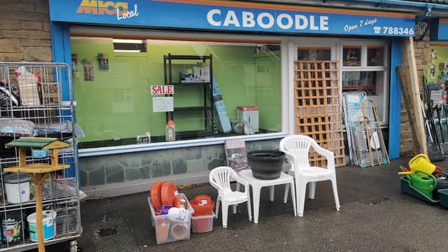 Bright storefront of Caboodle, featuring garden supplies, chairs, and a sale sign in York, Yorkshire.