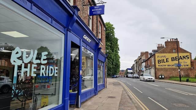 Giant Store York features a blue storefront with "Rule the Ride" signage, alongside a street view of nearby buildings.