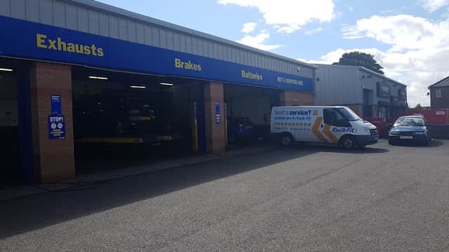 Kwik Fit garage in Redcar, featuring service bays, vehicles, and signage for exhausts, brakes, and batteries.