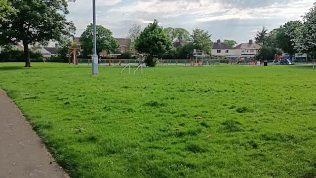 Green grassy area with trees, playground equipment in the background, and a cloudy sky over Thornaby, Yorkshire.