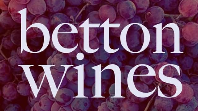Purple grapes with the text "betton wines" prominently displayed in a stylish font.
