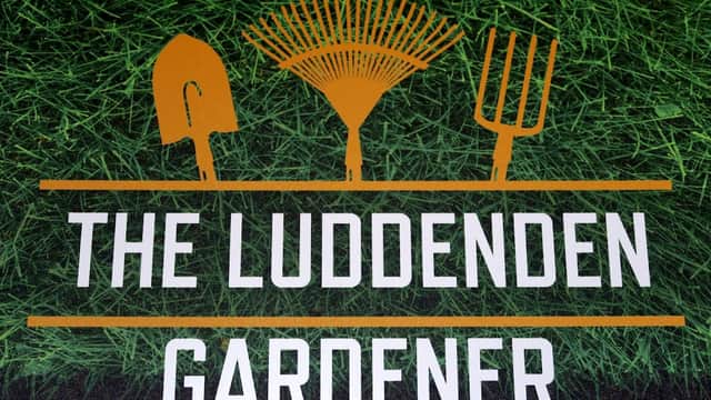 Sign for "The Luddenden Gardener" featuring gardening tools on a green grass background.
