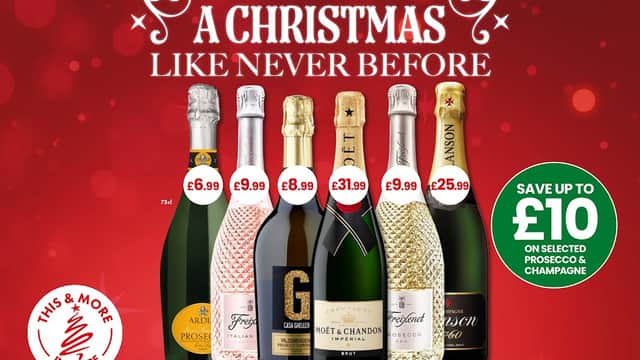 Christmas-themed promotional poster featuring various sparkling wines and champagnes with prices and savings highlighted.
