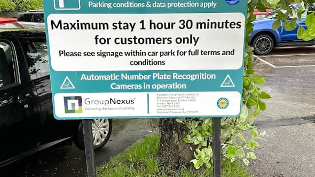 Sign detailing parking rules at Bradfield Road Car Park, including maximum stay and number plate recognition information.