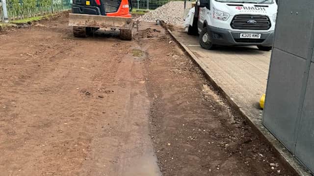 Excavator and delivery van on a construction site at Alpha 1 Machinery, Aven Industrial Park, Maltby, Yorkshire.