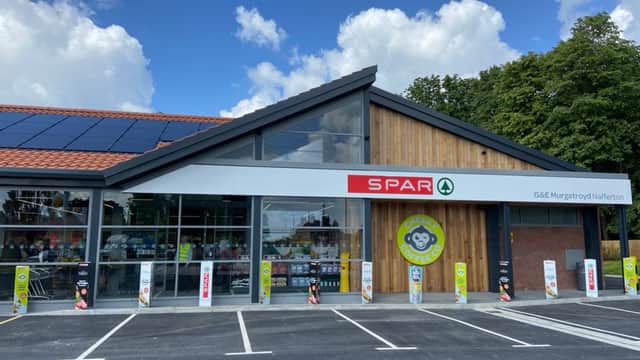 Spar grocery store in Nafferton, Yorkshire, featuring a modern design, large windows, and a parking area with signage.