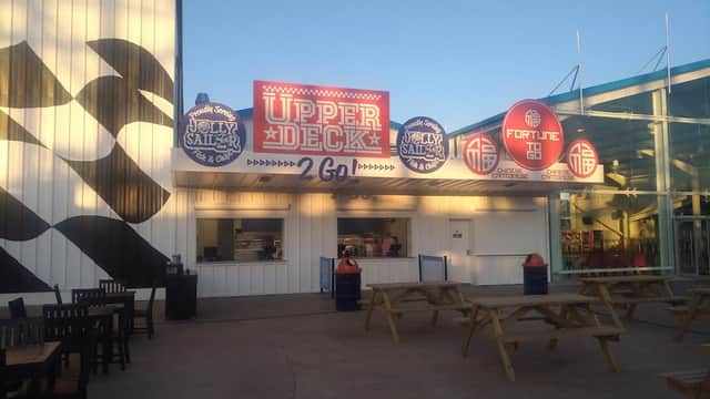 Upper Deck food stall at The Jolly Sailor, featuring colorful signage and outdoor seating in Kirby Misperton.