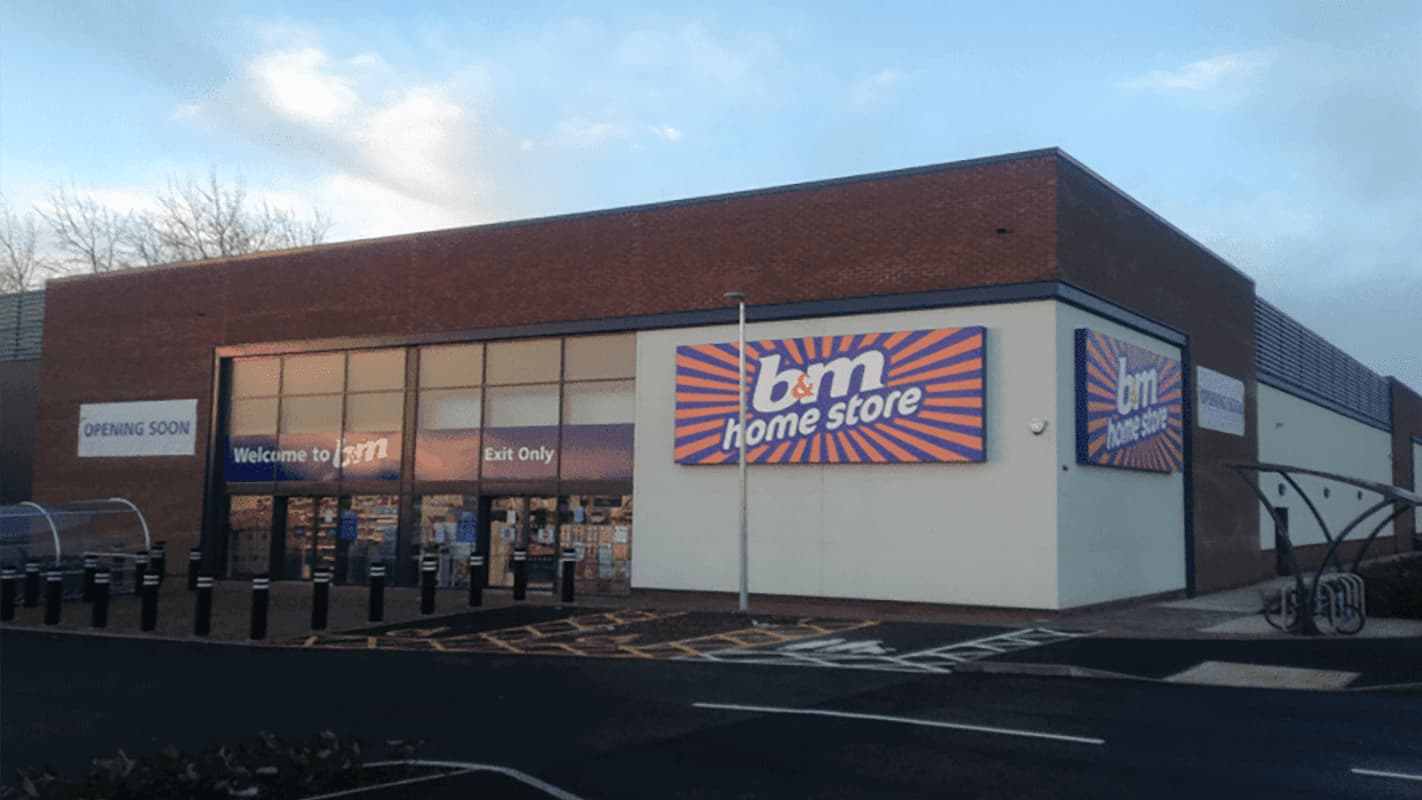 B&M Home Store exterior with large colorful signage, entrance, and parking area in Catterick Garrison, Yorkshire.
