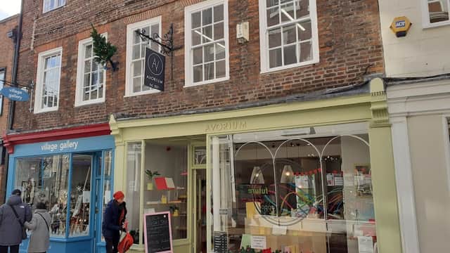 Avorium stationery shop with large windows, colorful displays, and a brick facade in York, Yorkshire.