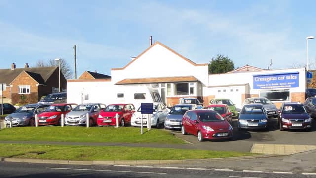 Hopes Garage at Crossgates car sales, featuring a variety of parked cars and a shop front in Scarborough, Yorkshire.
