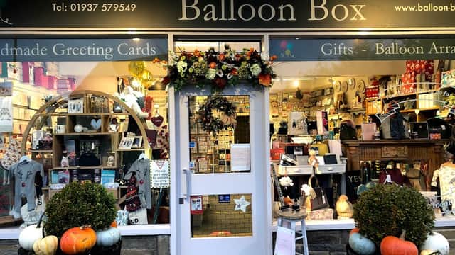 Shopfront of Balloon Box in Collingham, featuring colorful gifts, greeting cards, and seasonal decorations.
