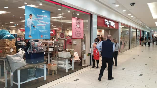 Frenchgate shopping center in Doncaster, featuring storefronts, shoppers, and promotional signage.