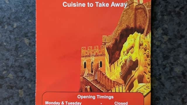 Red menu featuring "Galaxy" restaurant name, opening hours, and contact information, with a castle graphic.