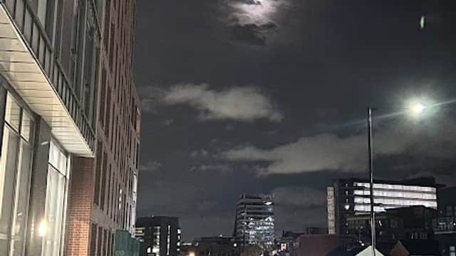 Nighttime view of Setts Car Parking Place, with cobbled street, moonlit sky, and city buildings in Sheffield.