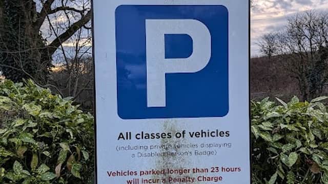Sign for The Green Car Park with a blue 'P' symbol, stating free parking for 23 hours in Nappa, North Yorkshire.