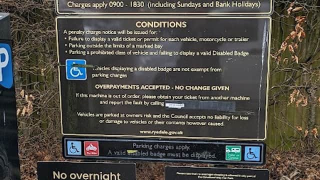 Signage for Cleveland Way Car Park in Helmsley, Yorkshire, detailing parking conditions and payment instructions.