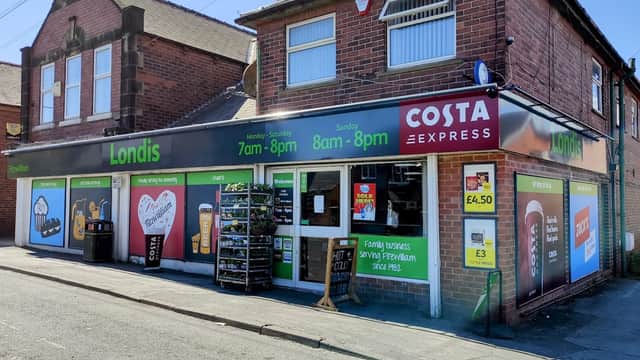 Londis grocery store with a Costa Express sign, open hours displayed, and colorful advertisements on the exterior.