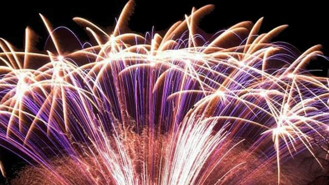 Colorful fireworks bursting in the night sky, creating a vibrant display of light and patterns.