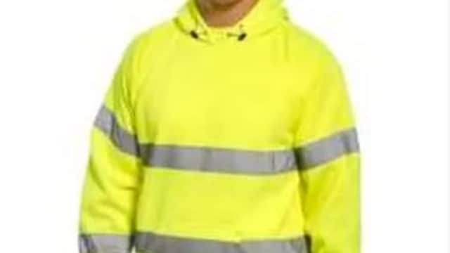 A man wearing a bright yellow high-visibility hoodie with reflective stripes.