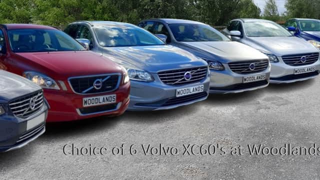 Six Volvo XC60 cars in various colors displayed at Woodlands Cars Ltd in Rillington, Yorkshire.