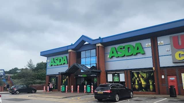 ASDA store with green signage, parked cars, and a cloudy sky at Queens Road Retail Park, Sheffield.