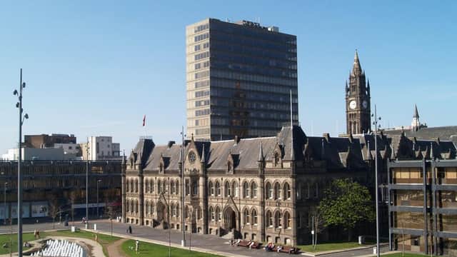 Centre Square features a mix of modern and historic architecture, with green spaces and a clock tower in the background.