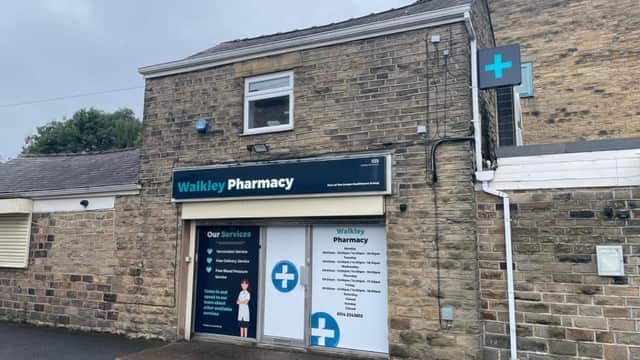 Walkley Pharmacy building with stone facade, signage for vaccination and travel clinic, and a blue cross symbol.