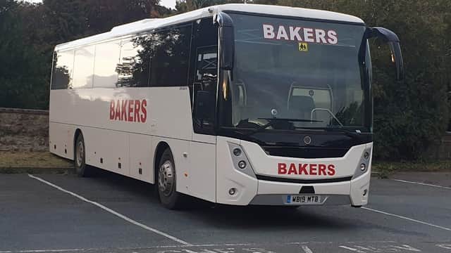 Bakers-branded coach parked in Wentworth Street Car Park, with "COACHES / MIN" signage visible.