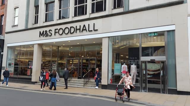 Marks & Spencer Foodhall storefront with shoppers, featuring large glass doors and prominent signage in Harrogate.