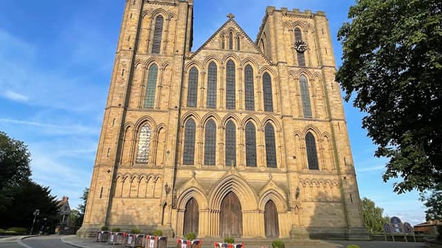St Marygate Car Park with a view of the grand, historic Ripon Cathedral against a blue sky.