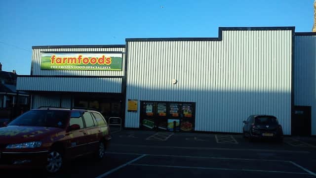 Farmfoods Ltd shop exterior in Redcar, featuring a sign and large windows, with parked cars in front.