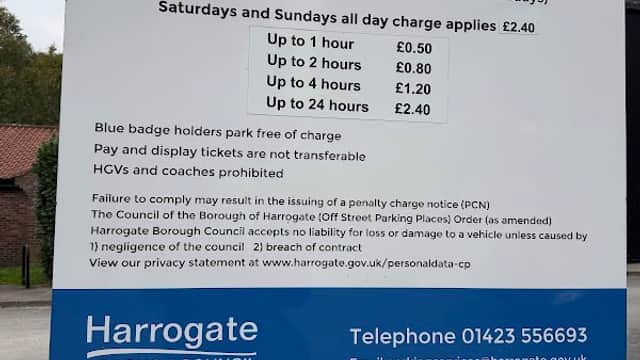 Sign detailing pay and display charges for parking at Waterside, Knaresborough, including fines and contact information.