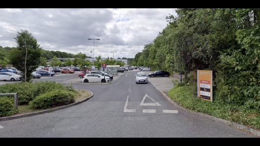 Parking lot entrance with cars, greenery, and a sign for "YourParkingSpace" in Moortown, Yorkshire.