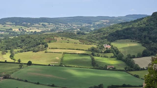 Scenic view of lush green fields and rolling hills from Low Town Bank Road car park in Hood Grange, Yorkshire.