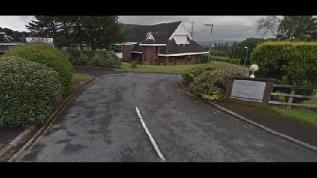 A winding road leads to a modern building surrounded by greenery in West Vale, Yorkshire.