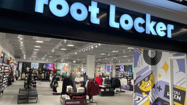 Foot Locker store entrance with bright signage, showcasing athletic shoes and apparel inside a modern retail space.