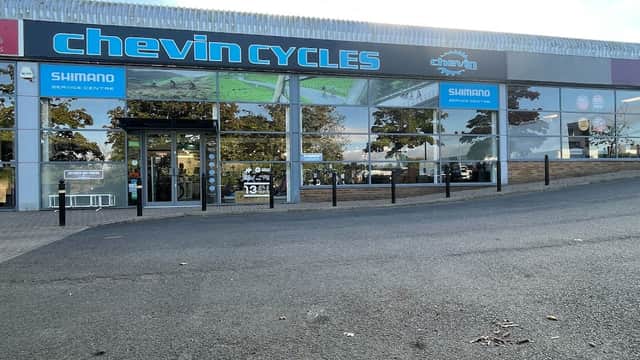 Chevin Cycles storefront in Harrogate, featuring large windows, signage, and a service center entrance.