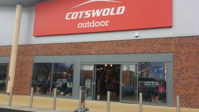 Cotswold Outdoor shop front in Catterick Garrison, featuring large red signage and glass entrance with outdoor gear displays.