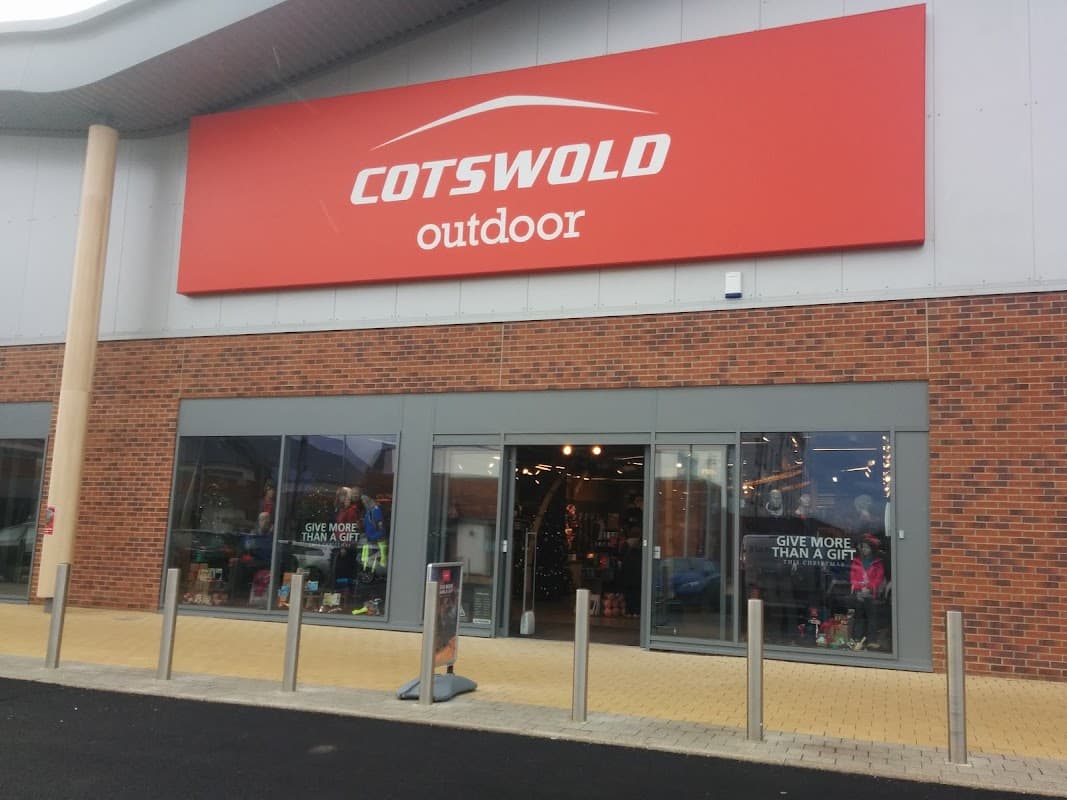 Cotswold Outdoor shop front in Catterick Garrison, featuring large red signage and glass entrance with outdoor gear displays.